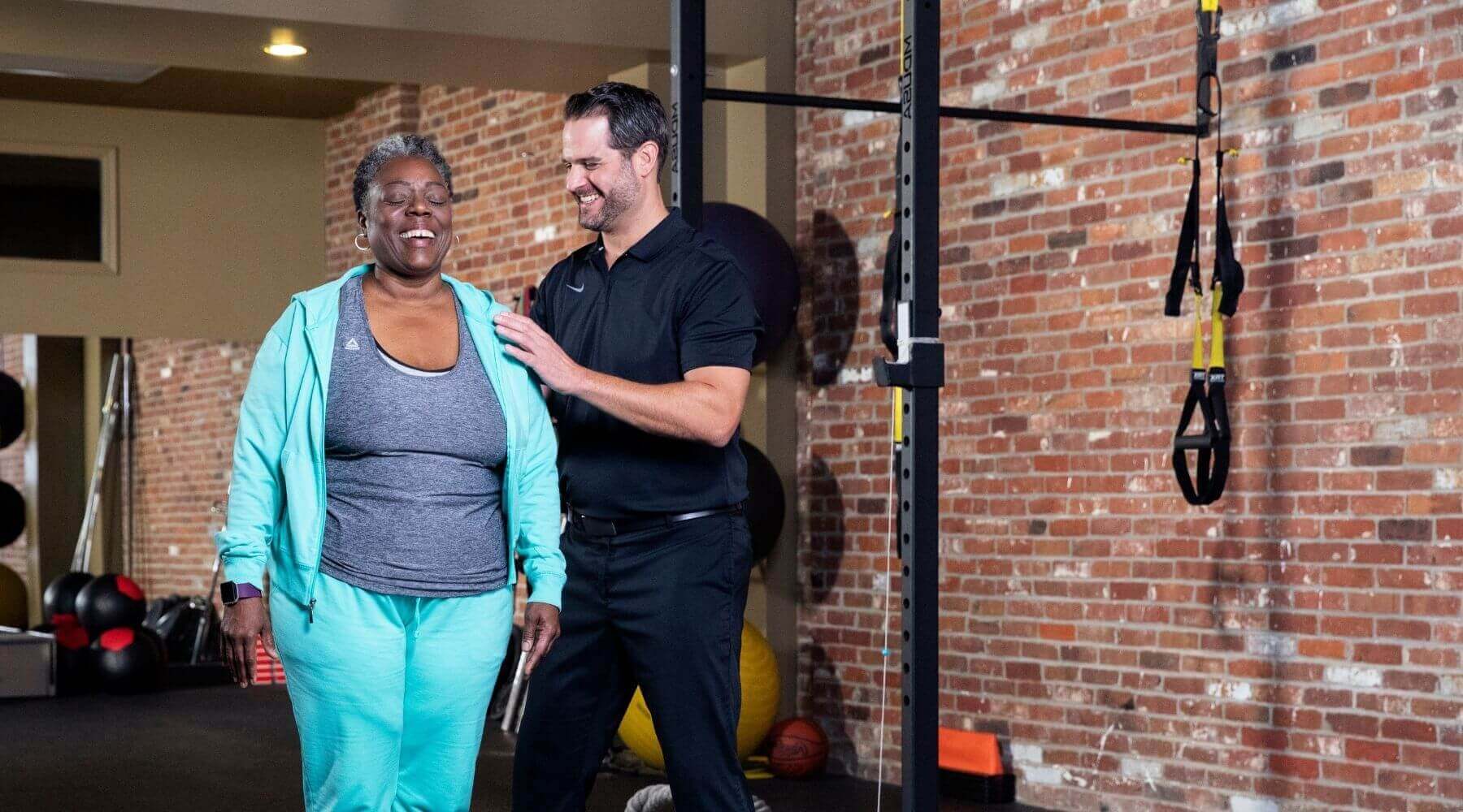 Male therapist with female patient balancing