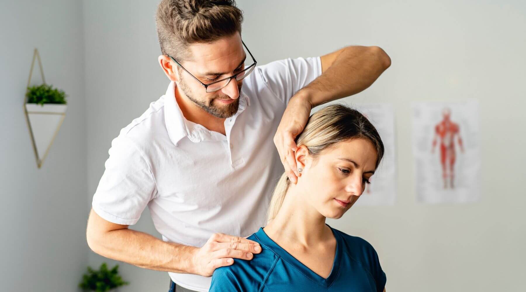 Therapist stretching patient neck