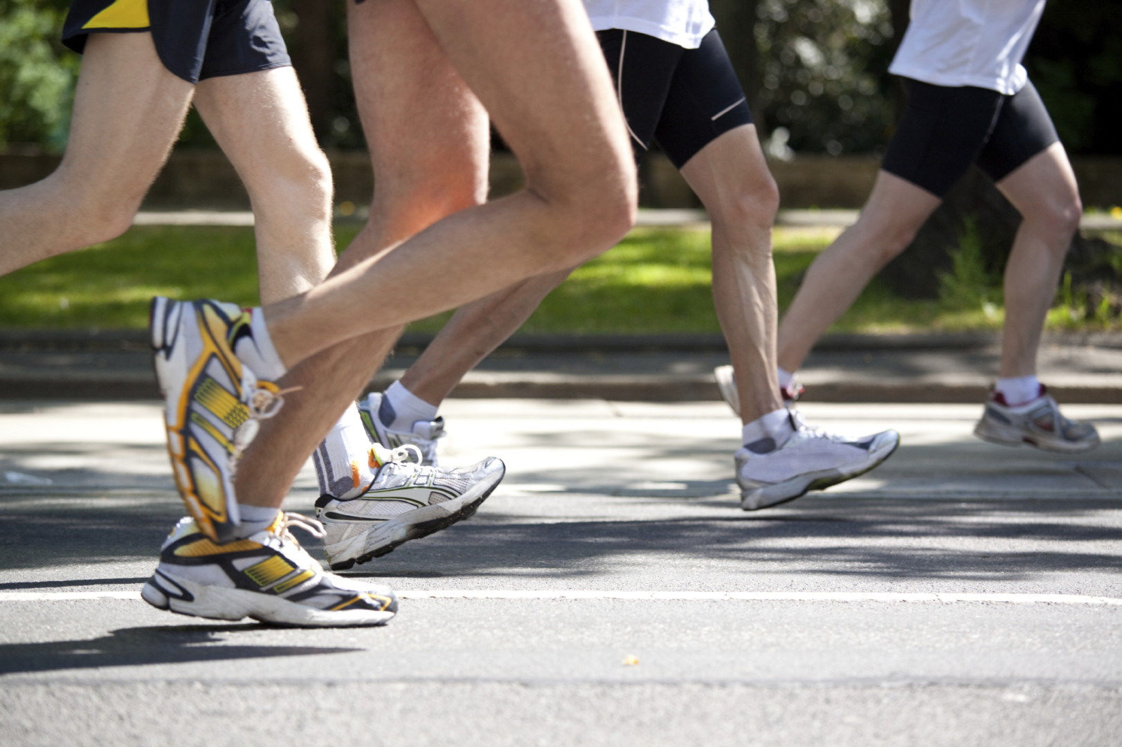 marathon legs in motion on street