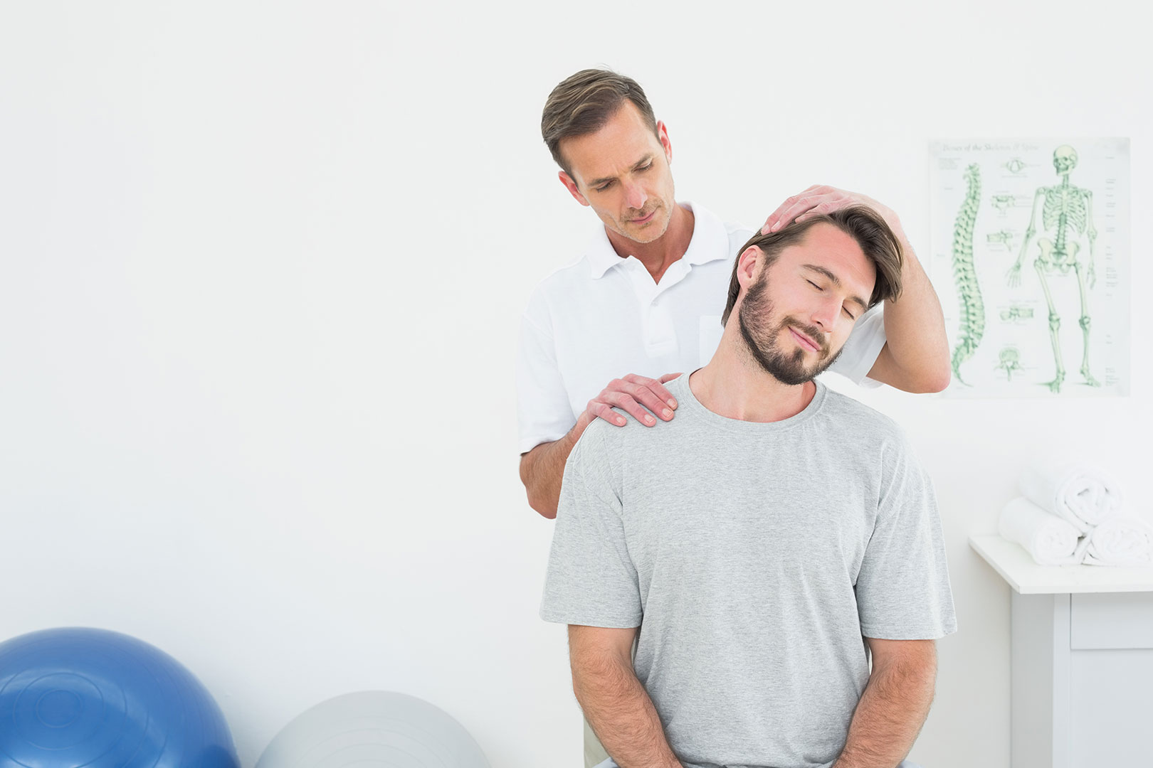 male patient getting neck examined