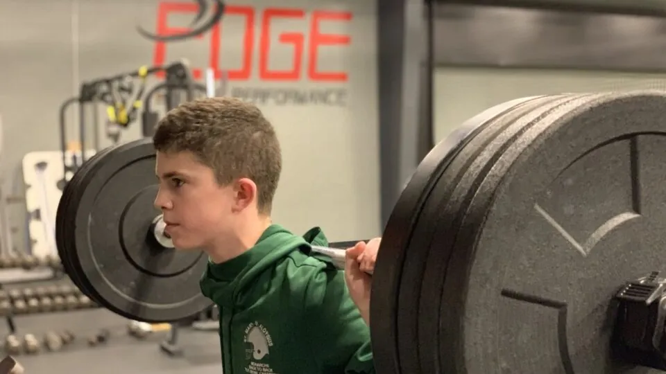 young man lifting weights