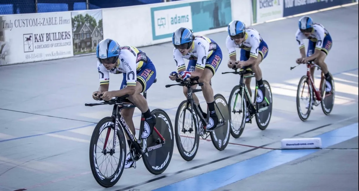 four people riding a bike