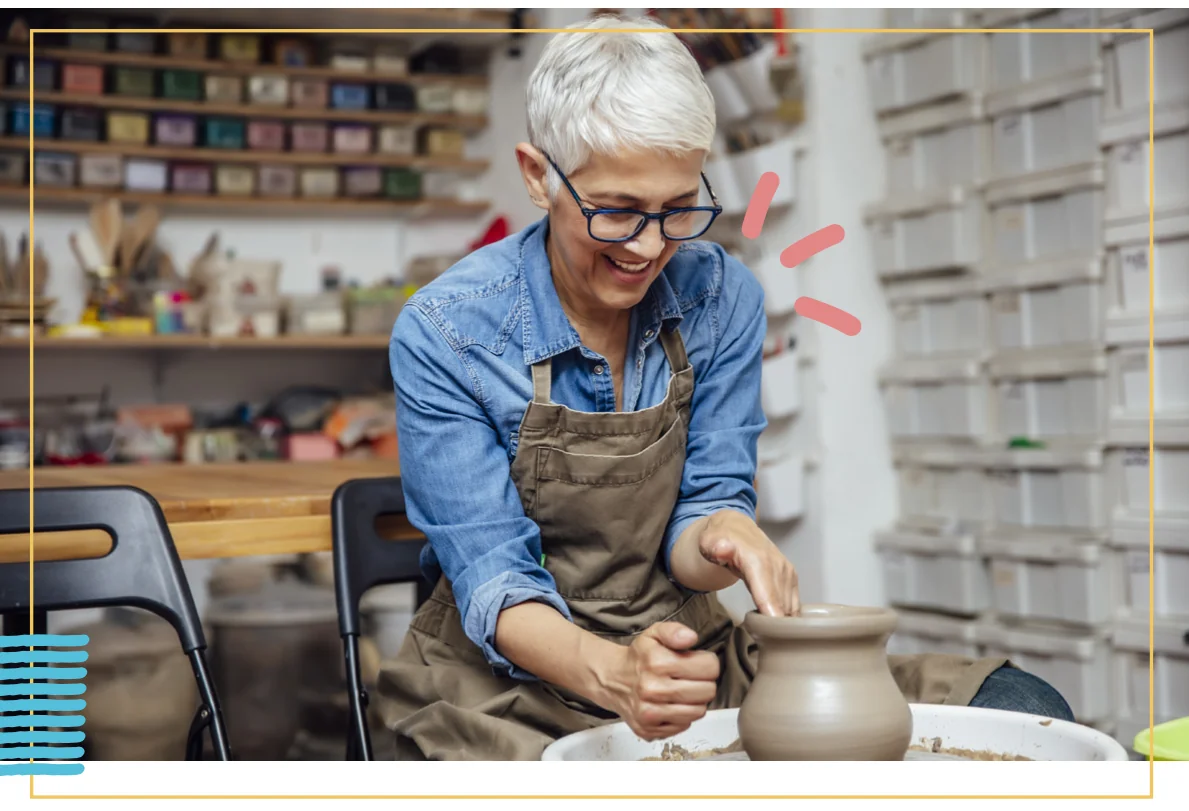 senior woman making pottery