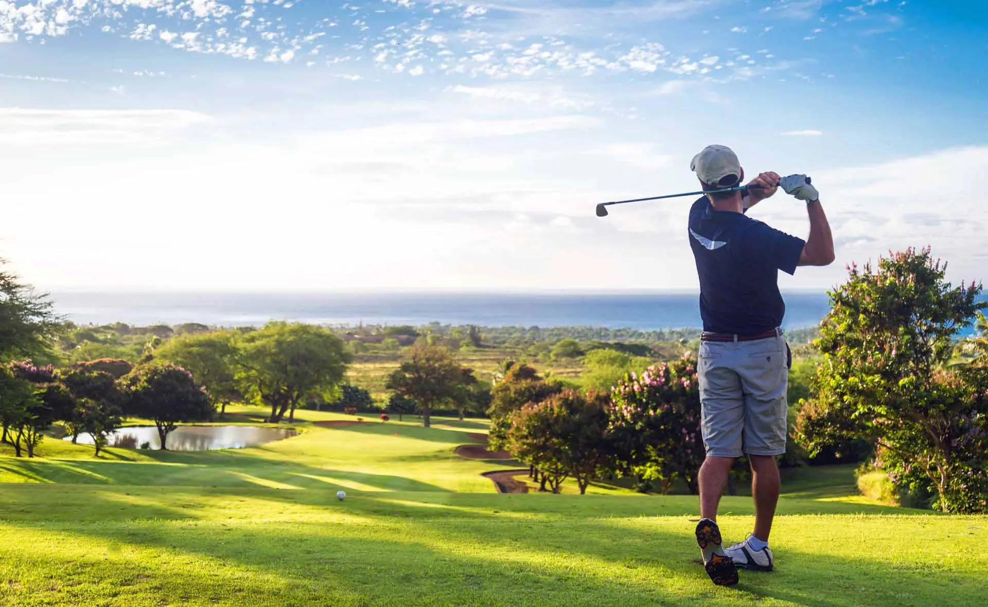 man swinging golf club