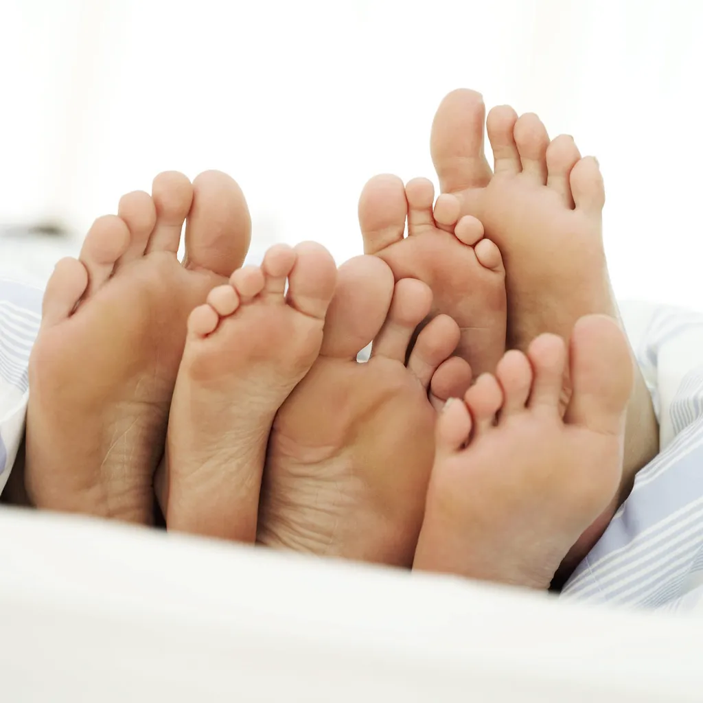 bottom of three pairs of feet
